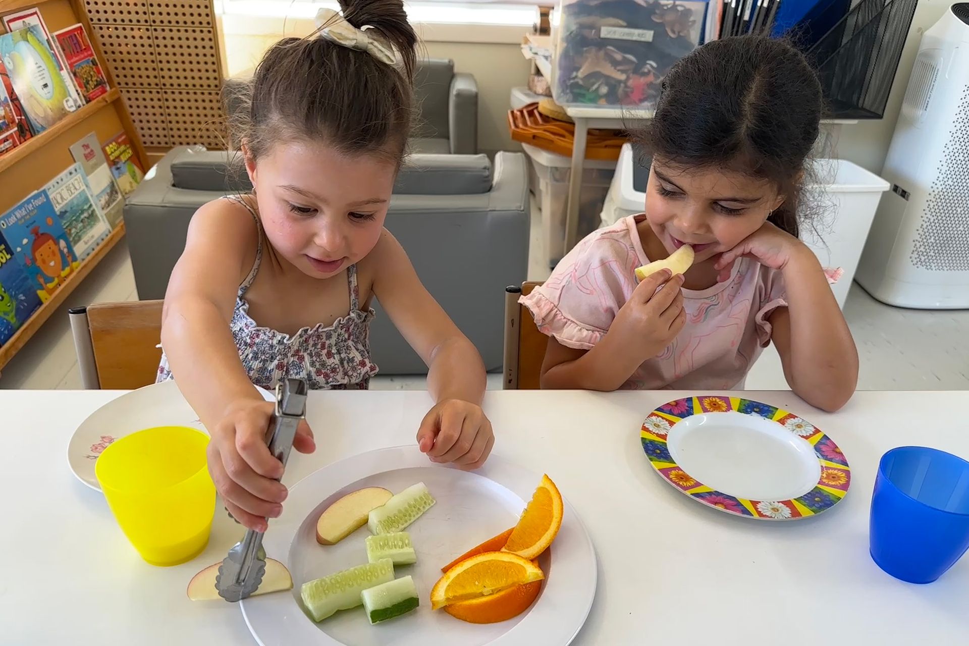Children preparing and enjoying fresh fruit at A.C.E