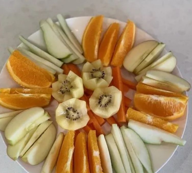 A colourful platter of sliced fresh fruit